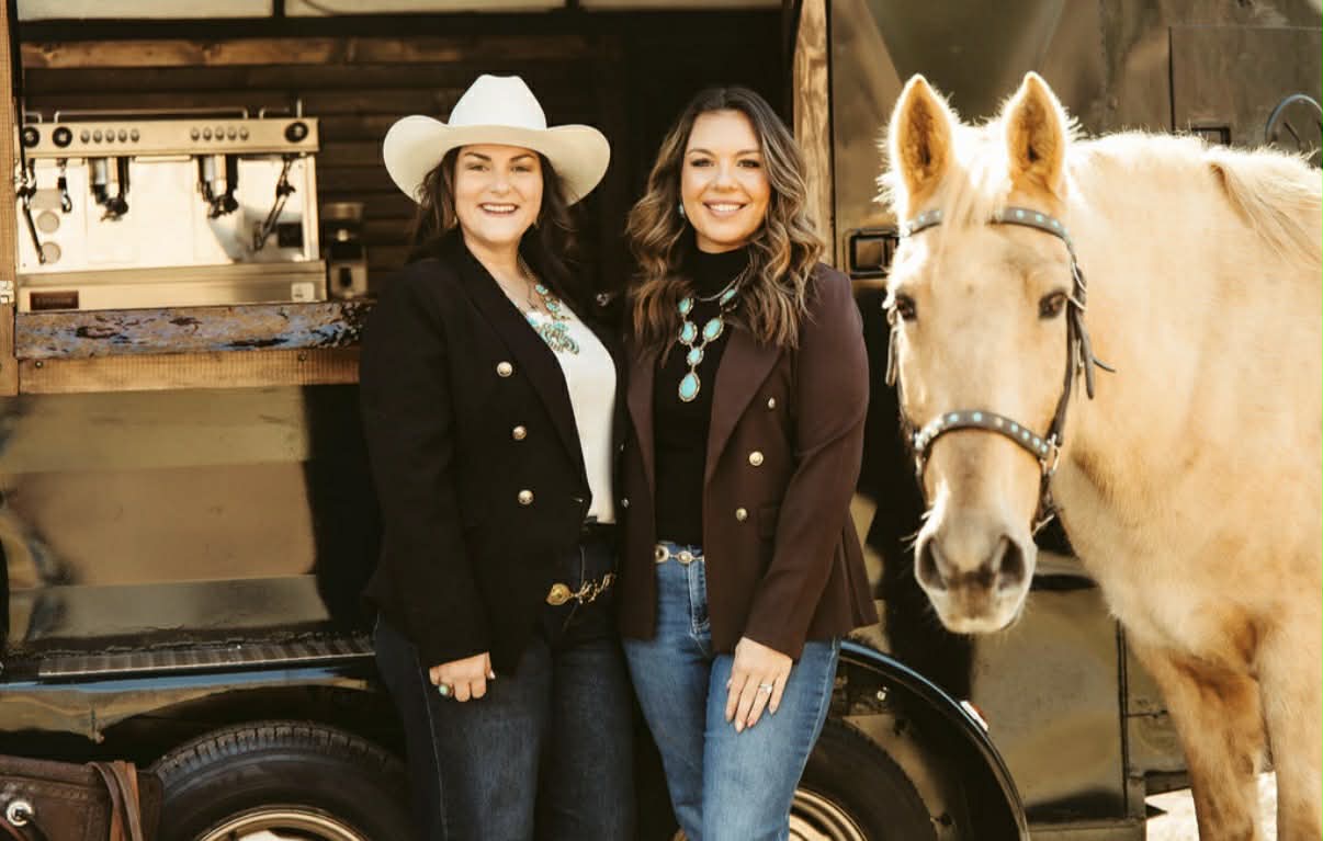 The Pour Mare founders celebrating in front of the trailer