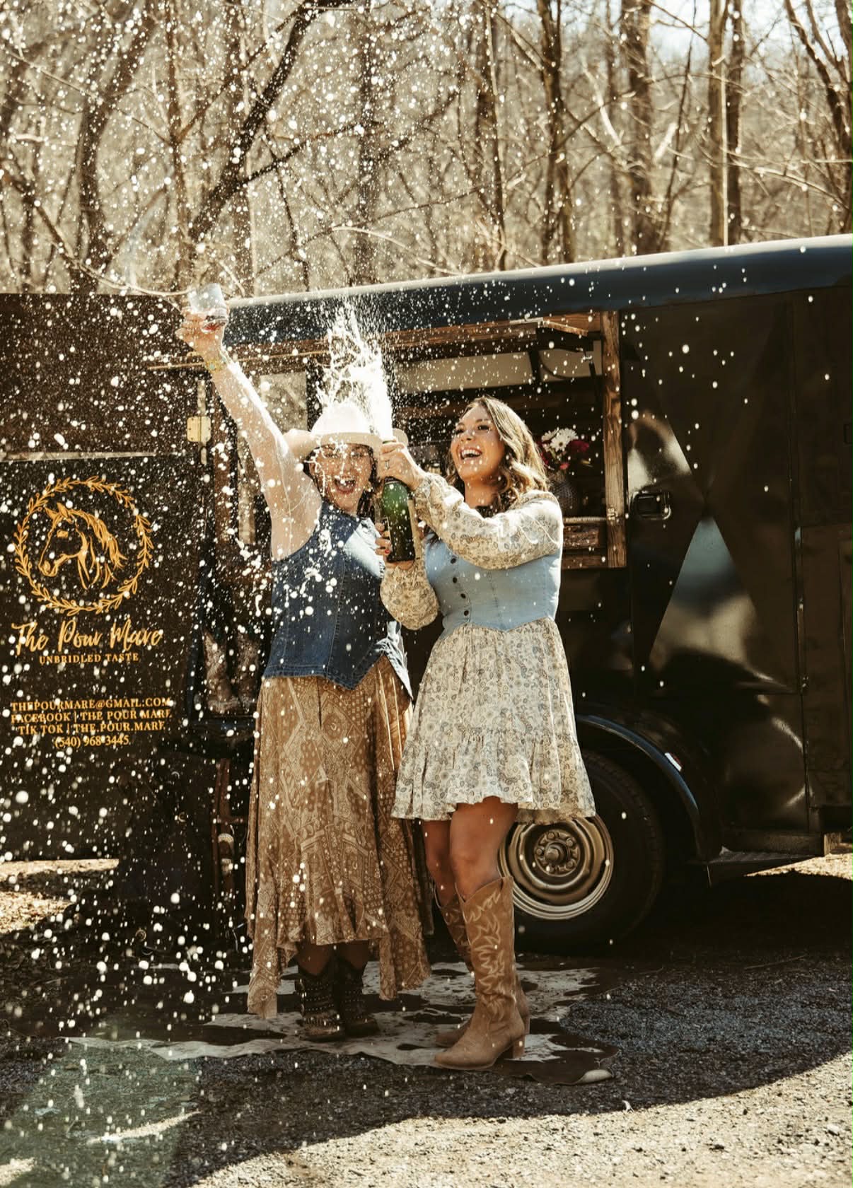 The Pour Mare founders with a horse beside the trailer